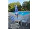 Community pool featuring seating and tables with umbrella for shade during warm days at 2467 Sky Valley Dr, Dacula, GA 30019