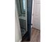 Cozy powder room featuring a blue accent door and stylish floral mosaic tile at 2467 Sky Valley Dr, Dacula, GA 30019