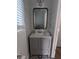 Elegant powder room with shiplap walls and a gray vanity with bronze hardware at 2467 Sky Valley Dr, Dacula, GA 30019