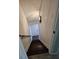 View of stairs with handrail, modern wainscoting, and dark wood steps at 2467 Sky Valley Dr, Dacula, GA 30019