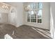 Elegant dining area with wood flooring, large windows, and stylish chandelier lighting at 428 Riverwood Pass, Dallas, GA 30157