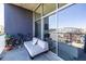 This spacious balcony features a contemporary couch and bike, perfect for relaxing outdoors at 130 Arizona Ne Ave # 302, Atlanta, GA 30307