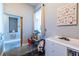 Bedroom featuring an abundance of natural light, playful decor, and a cozy seating area at 130 Arizona Ne Ave # 302, Atlanta, GA 30307