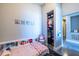 Bedroom features a built-in headboard and a neatly organized closet at 130 Arizona Ne Ave # 302, Atlanta, GA 30307