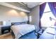 Comfortable bedroom featuring large window and a dedicated workspace at 130 Arizona Ne Ave # 302, Atlanta, GA 30307