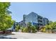 Modern condominium building showcasing a sleek design and lush landscaping at 130 Arizona Ne Ave # 302, Atlanta, GA 30307