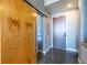 Hallway featuring modern finishes, stylish sliding barn door and access to multiple rooms at 130 Arizona Ne Ave # 302, Atlanta, GA 30307