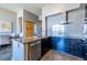 Well-appointed kitchen showcasing sleek cabinetry, granite countertops, stainless appliances and a sliding barn door at 130 Arizona Ne Ave # 302, Atlanta, GA 30307