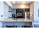 Modern kitchen featuring granite countertops, stainless steel appliances, and bar seating at 130 Arizona Ne Ave # 302, Atlanta, GA 30307