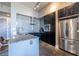 Granite countertops, stainless steel appliances, and dark cabinets in modern kitchen at 130 Arizona Ne Ave # 302, Atlanta, GA 30307