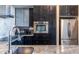Close up on kitchen details: granite countertops, stainless steel appliances, and modern backsplash at 130 Arizona Ne Ave # 302, Atlanta, GA 30307