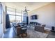Light filled living room features modern furnishings and expansive windows with views at 130 Arizona Ne Ave # 302, Atlanta, GA 30307