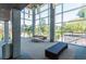 Bright, modern lounge area with large windows, contemporary furniture, and sleek concrete pillars at 130 Arizona Ne Ave # 302, Atlanta, GA 30307