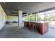 Modern lounge with breakfast bar, stools, large windows and contemporary lighting fixtures at 130 Arizona Ne Ave # 302, Atlanta, GA 30307
