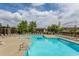 Beautiful swimming pool with plenty of lounge chairs for residents on a sunny day at 130 Arizona Ne Ave # 302, Atlanta, GA 30307
