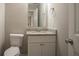 Neutral half bathroom features a granite countertop and a new toilet at 201 Coral Cir, Mcdonough, GA 30253