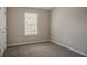 Bedroom with neutral carpet and a window at 201 Coral Cir, Mcdonough, GA 30253