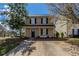 Charming two-story home featuring a well-maintained lawn, a concrete driveway, and classic black shutters at 201 Coral Cir, Mcdonough, GA 30253
