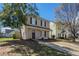 Charming two-story home with a manicured lawn, inviting entrance, and a long concrete driveway at 201 Coral Cir, Mcdonough, GA 30253