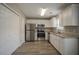 Modern kitchen featuring stainless steel appliances, granite countertops, and ample storage space at 201 Coral Cir, Mcdonough, GA 30253