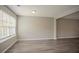 Bright living room featuring hardwood floors and neutral paint palette at 201 Coral Cir, Mcdonough, GA 30253