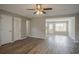 Inviting living room showcasing hardwood floors, white trim, and a seamless transition to the kitchen at 201 Coral Cir, Mcdonough, GA 30253