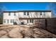 Exterior view of the back of the home with fenced yard and patio at 2544 Castellan Dr, Atlanta, GA 30316