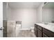 Well-appointed bathroom with a tiled shower and tub, modern vanity, and sleek fixtures for a luxurious feel at 2544 Castellan Dr, Atlanta, GA 30316