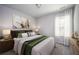 Cozy bedroom featuring a large window, neutral decor, and a comfortable bed perfect for relaxation at 2544 Castellan Dr, Atlanta, GA 30316