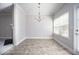 Bright dining area with neutral paint, chandelier, and door to the exterior at 2544 Castellan Dr, Atlanta, GA 30316