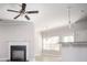 Bright living room with a ceiling fan, fireplace, and views to the kitchen at 2544 Castellan Dr, Atlanta, GA 30316