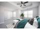 Bright, spacious main bedroom with tray ceiling, plush carpet, and large windows providing ample natural light at 2544 Castellan Dr, Atlanta, GA 30316