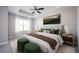 Inviting bedroom featuring a tray ceiling, soft carpet, and coordinated decor for a serene retreat at 2544 Castellan Dr, Atlanta, GA 30316