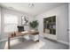 Well-lit office space with a modern desk, bookcase, and neutral decor at 2544 Castellan Dr, Atlanta, GA 30316