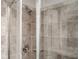 Tiled shower with glass door and chrome hardware at 2544 Castellan Dr, Atlanta, GA 30316