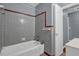 Functional bathroom featuring a tub with tile surround and classic fixtures at 2675 Davidson Dr, Lithonia, GA 30058