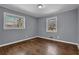 Bright bedroom with hardwood floors, natural light and neutral colored walls at 2675 Davidson Dr, Lithonia, GA 30058