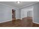 An open layout living room featuring hardwood floors and neutral-colored walls at 2675 Davidson Dr, Lithonia, GA 30058