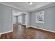 Bright living room featuring hardwood floors, neutral paint, and an open layout at 2675 Davidson Dr, Lithonia, GA 30058