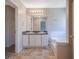 Bathroom featuring a double sink vanity, and tiled flooring adjacent to a separate room at 3021 Hampton Club Way, Lithonia, GA 30038