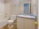 The bathroom includes a shower-tub combo, vanity, and a mirror above the sink at 3021 Hampton Club Way, Lithonia, GA 30038