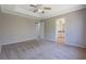 A carpeted bedroom with entrances to other rooms, offering a glimpse of the home's layout at 3021 Hampton Club Way, Lithonia, GA 30038