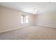Carpeted bedroom with neutral walls and a bright window at 3021 Hampton Club Way, Lithonia, GA 30038