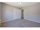 Carpeted bedroom with neutral walls and a closet at 3021 Hampton Club Way, Lithonia, GA 30038