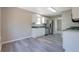 Modern kitchen with stainless steel appliances and a view to the carpeted living room at 3021 Hampton Club Way, Lithonia, GA 30038