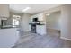 View of kitchen with stainless steel appliances, white cabinets, and green countertops at 3021 Hampton Club Way, Lithonia, GA 30038