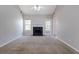 Spacious living room with high ceiling, fireplace, and natural light at 3021 Hampton Club Way, Lithonia, GA 30038