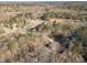 High angle view of secluded property surrounded by mature trees and other homes at 537 Pine Shadows Dr, Dallas, GA 30157