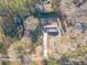 Aerial view of home and surrounding wooded lot at 537 Pine Shadows Dr, Dallas, GA 30157