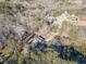 Wide aerial view showing the home in a wooded neighborhood at 537 Pine Shadows Dr, Dallas, GA 30157